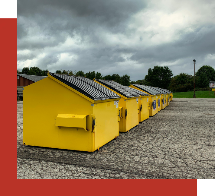 A row of yellow houses with solar panels on the roof.